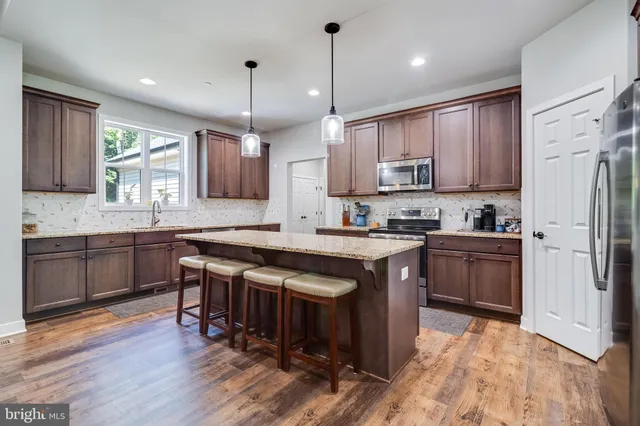 a bathroom with a shower and a sink
