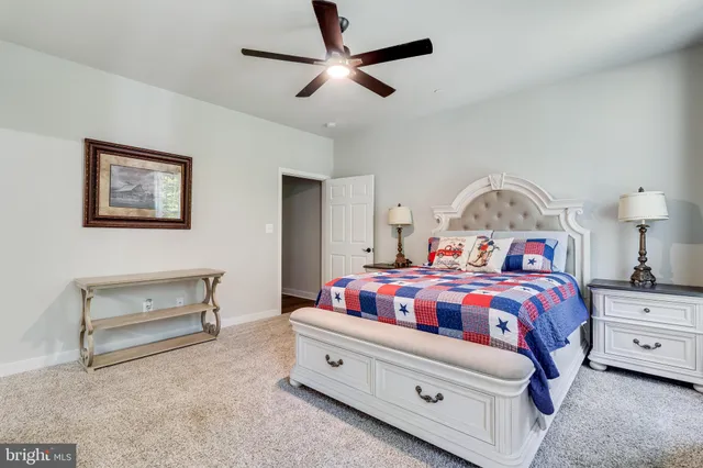 a bathroom with a double vanity sink toilet and a mirror