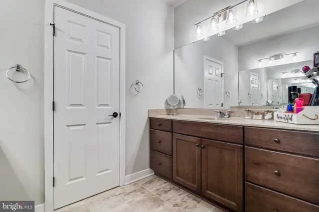 a view of a house with a garage and balcony