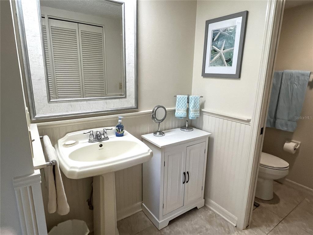 6503 Stone River Road, Unit 109 Bradenton, FL 34203 - Photo 26 of 65 a bathroom with a sink toilet and a mirror