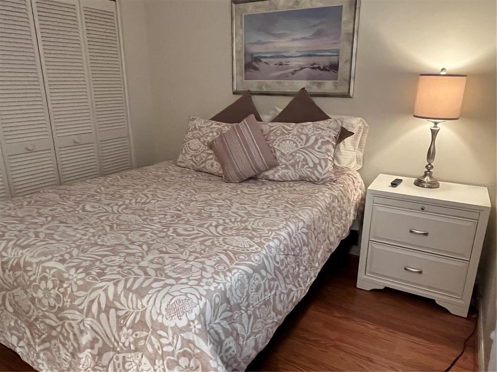 6503 Stone River Road, Unit 109 Bradenton, FL 34203 - Photo 31 of 65 a bedroom with a bed and a lamp