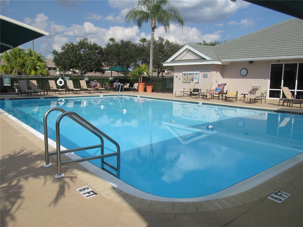 6503 Stone River Road, Unit 109 Bradenton, FL 34203 - Photo 47 of 65 a view of a swimming pool with outdoor seating