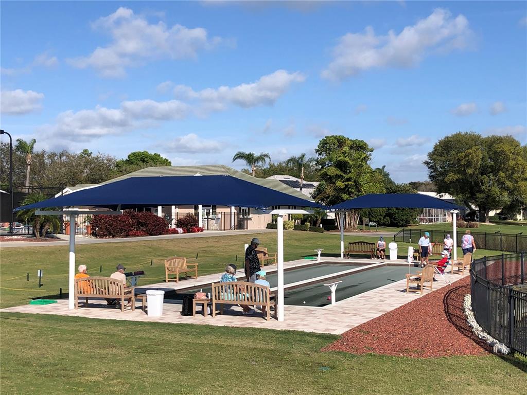6503 Stone River Road, Unit 109 Bradenton, FL 34203 - Photo 52 of 65 a view of a swimming pool with an outdoor seating