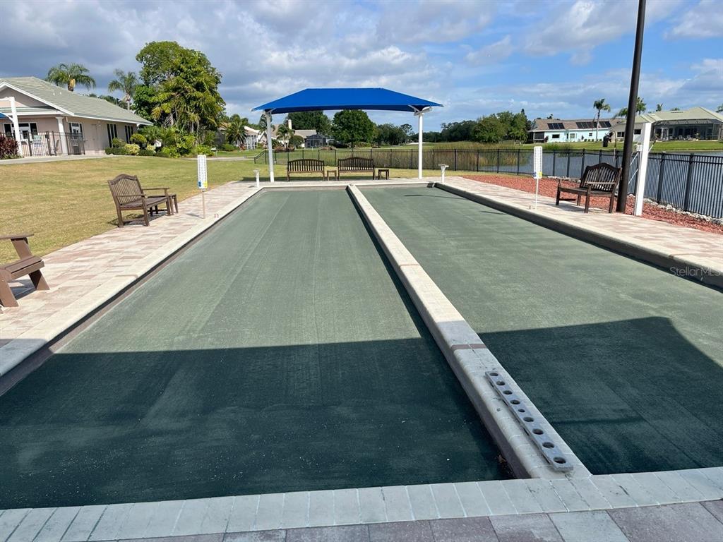 6503 Stone River Road, Unit 109 Bradenton, FL 34203 - Photo 57 of 65 a view of a swimming pool with a chair