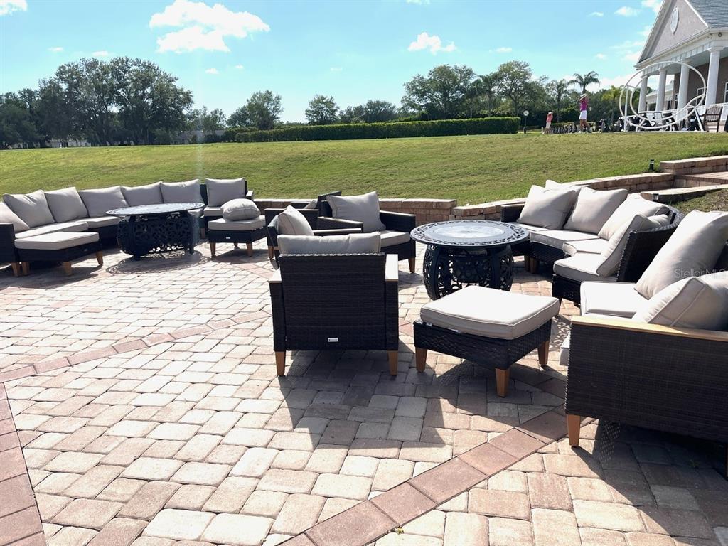 6503 Stone River Road, Unit 109 Bradenton, FL 34203 - Photo 61 of 65 a outdoor living space with furniture and a garden