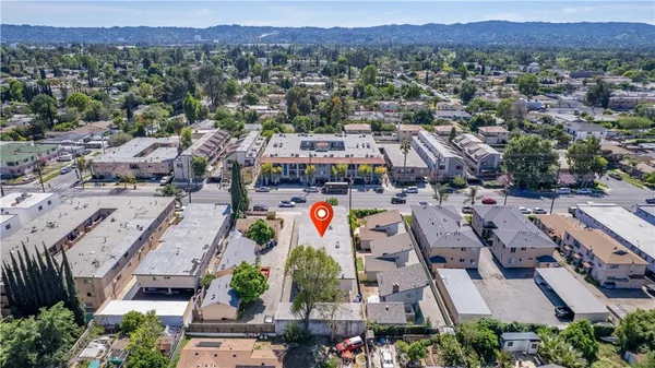 an aerial view of residential houses and outdoor space