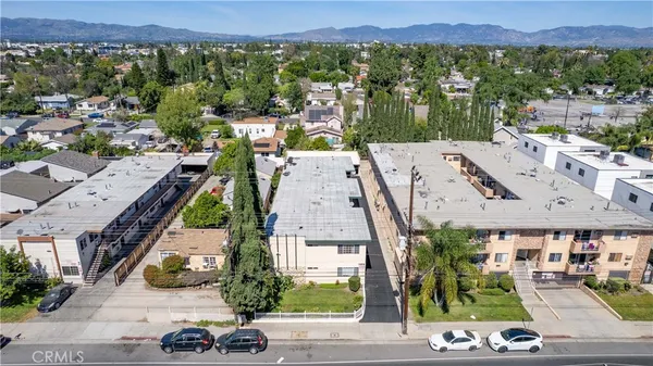 an aerial view of residential houses with outdoor space