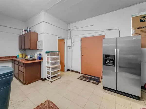 a kitchen with stainless steel appliances kitchen island granite countertop a sink and cabinets