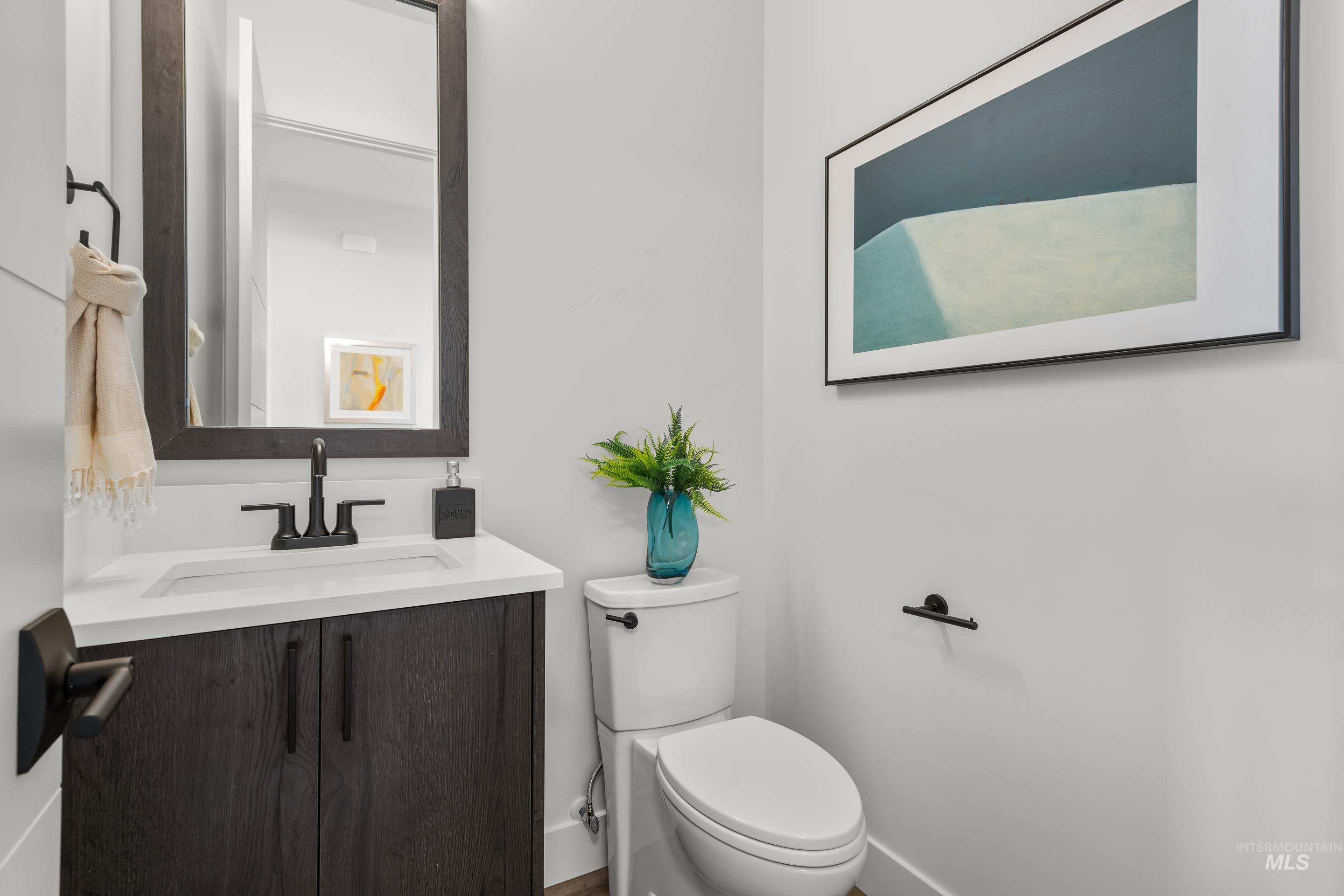 13 Blk 7 E Strut Way Boise, ID 83716 - Photo 24 of 50 Half bathroom with vanity and toilet