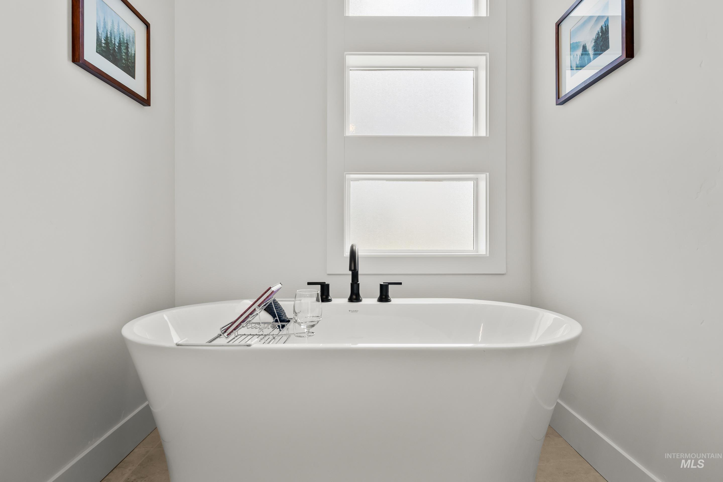 13 Blk 7 E Strut Way Boise, ID 83716 - Photo 31 of 50 Bathroom featuring a soaking tub and baseboards