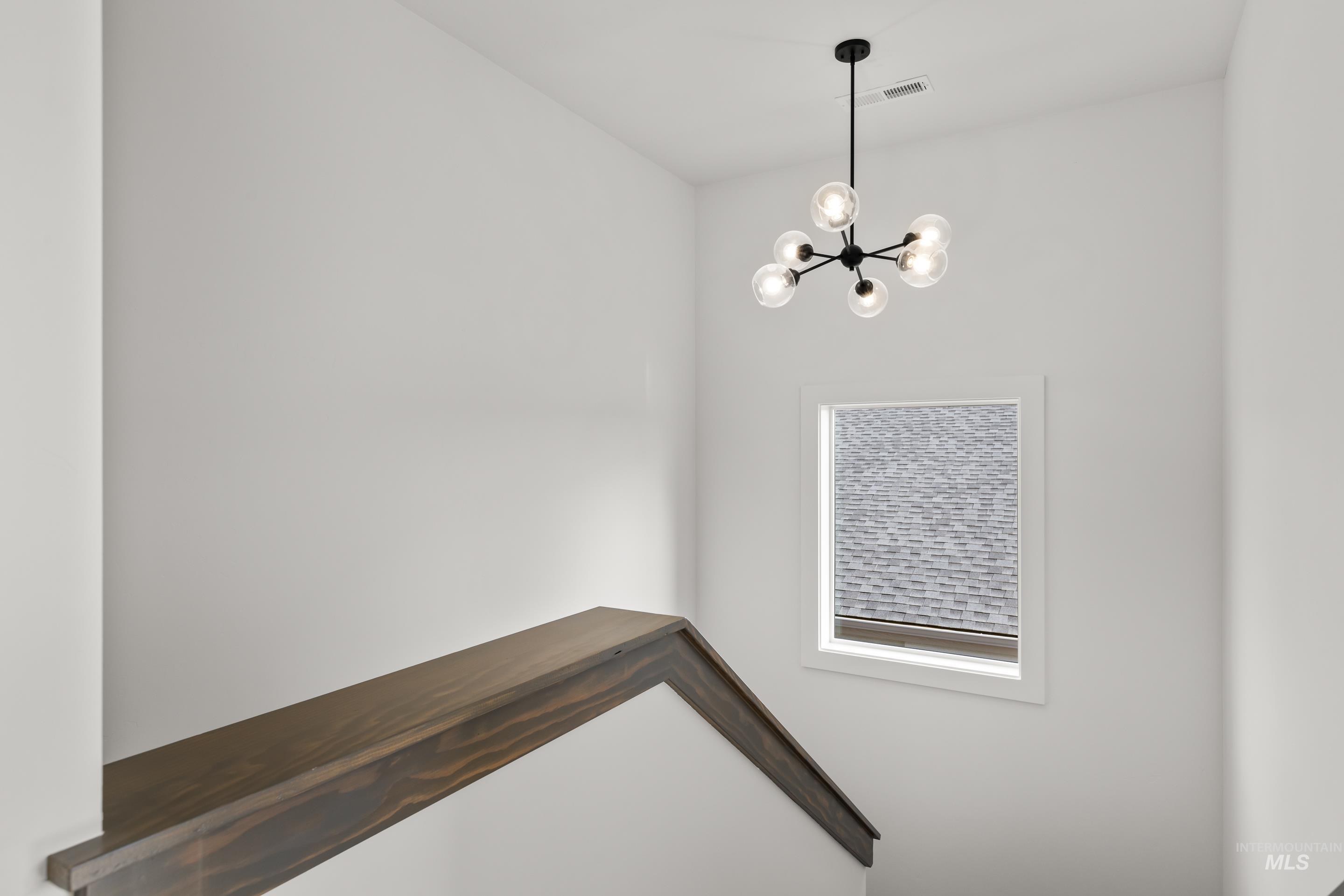 13 Blk 7 E Strut Way Boise, ID 83716 - Photo 38 of 50 Staircase with a chandelier