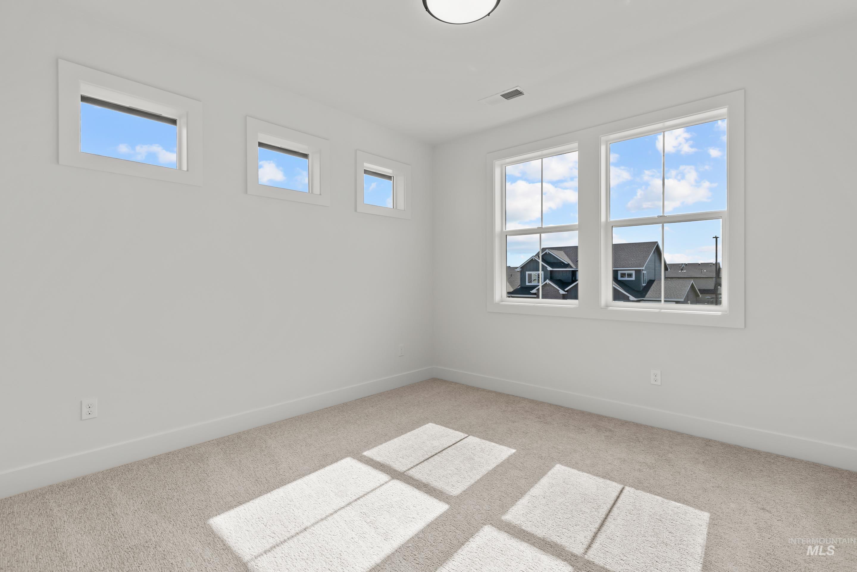 13 Blk 7 E Strut Way Boise, ID 83716 - Photo 39 of 50 Carpeted spare room featuring baseboards