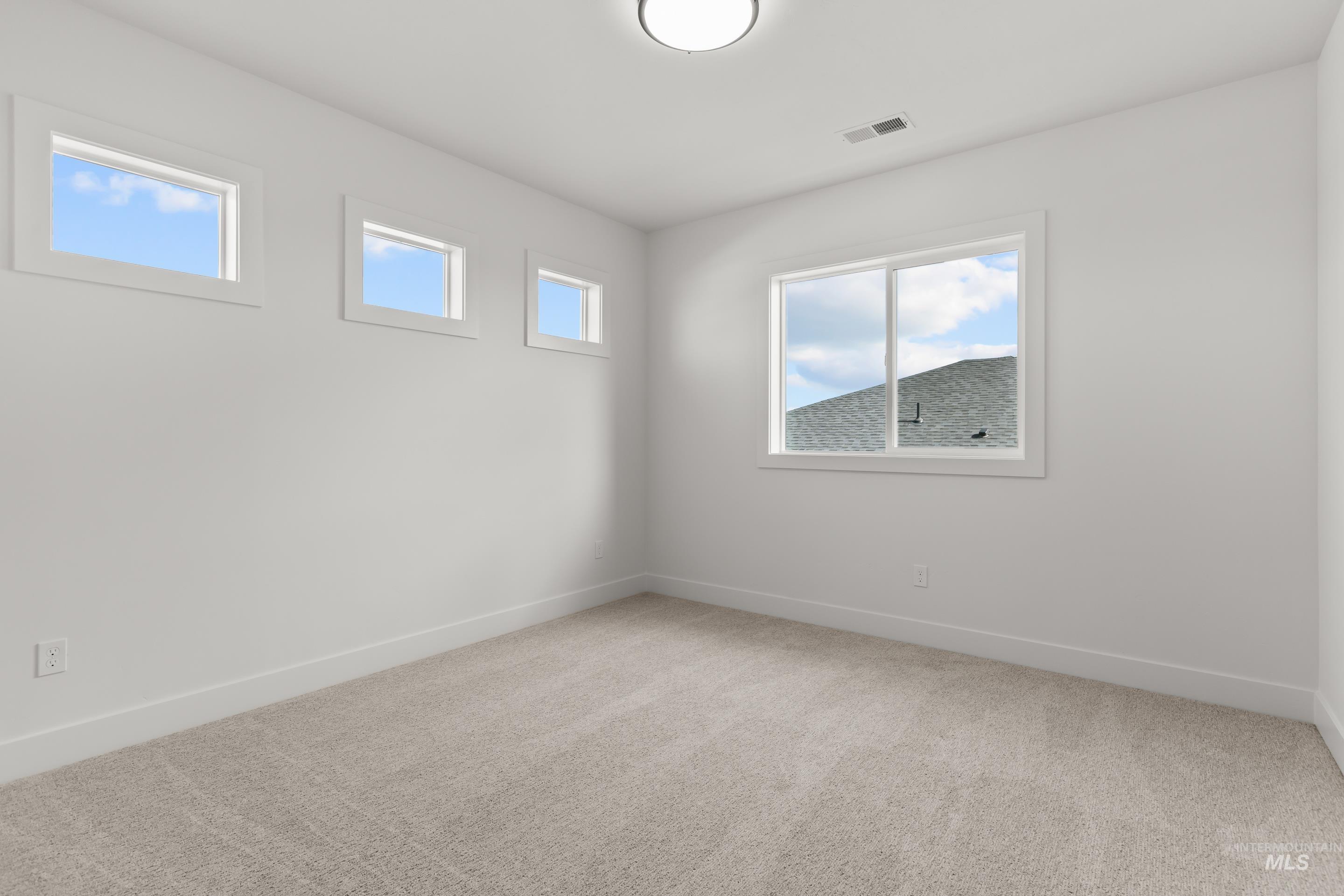 13 Blk 7 E Strut Way Boise, ID 83716 - Photo 41 of 50 Unfurnished room with light carpet and plenty of natural light