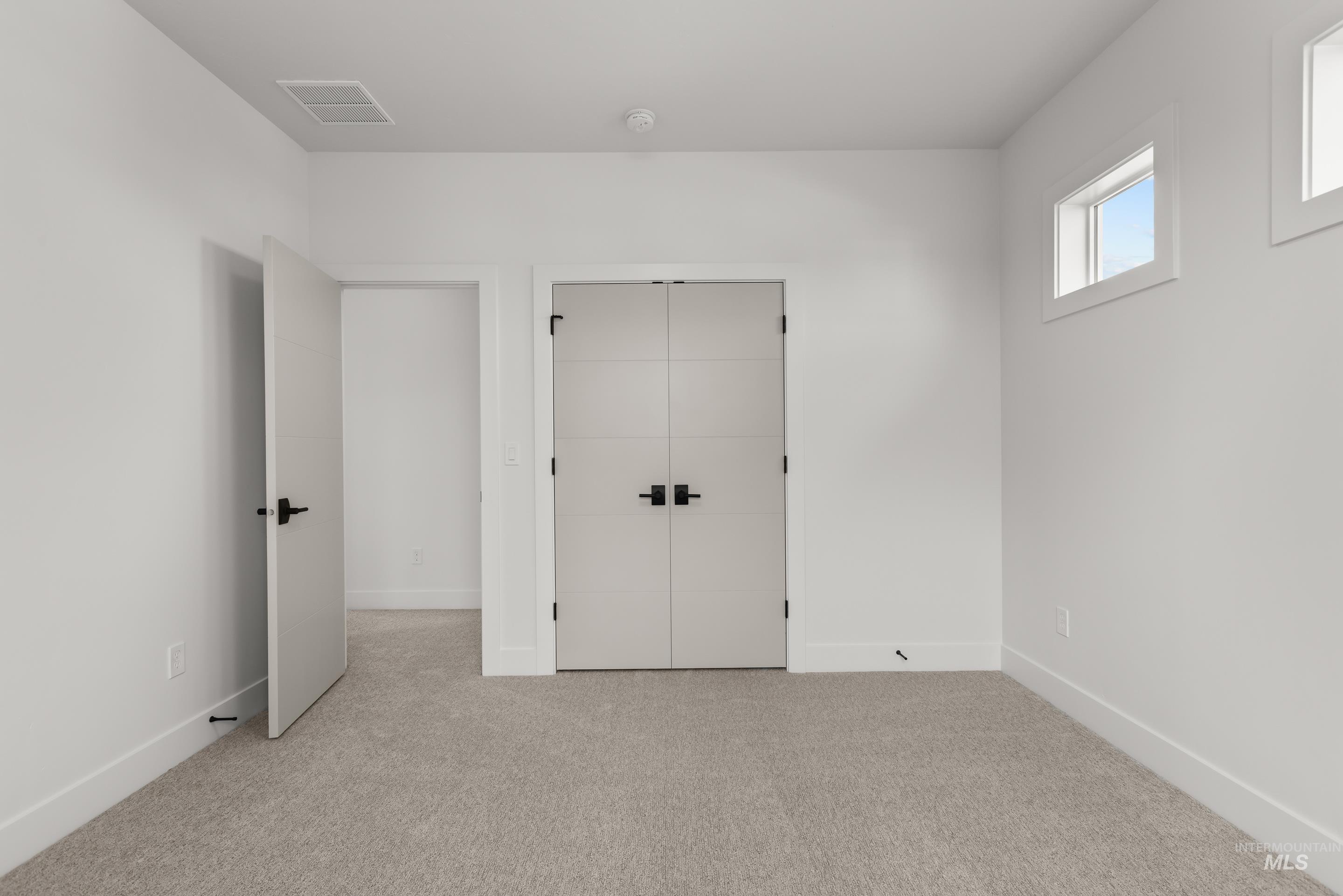 13 Blk 7 E Strut Way Boise, ID 83716 - Photo 42 of 50 Unfurnished bedroom featuring carpet flooring and a closet