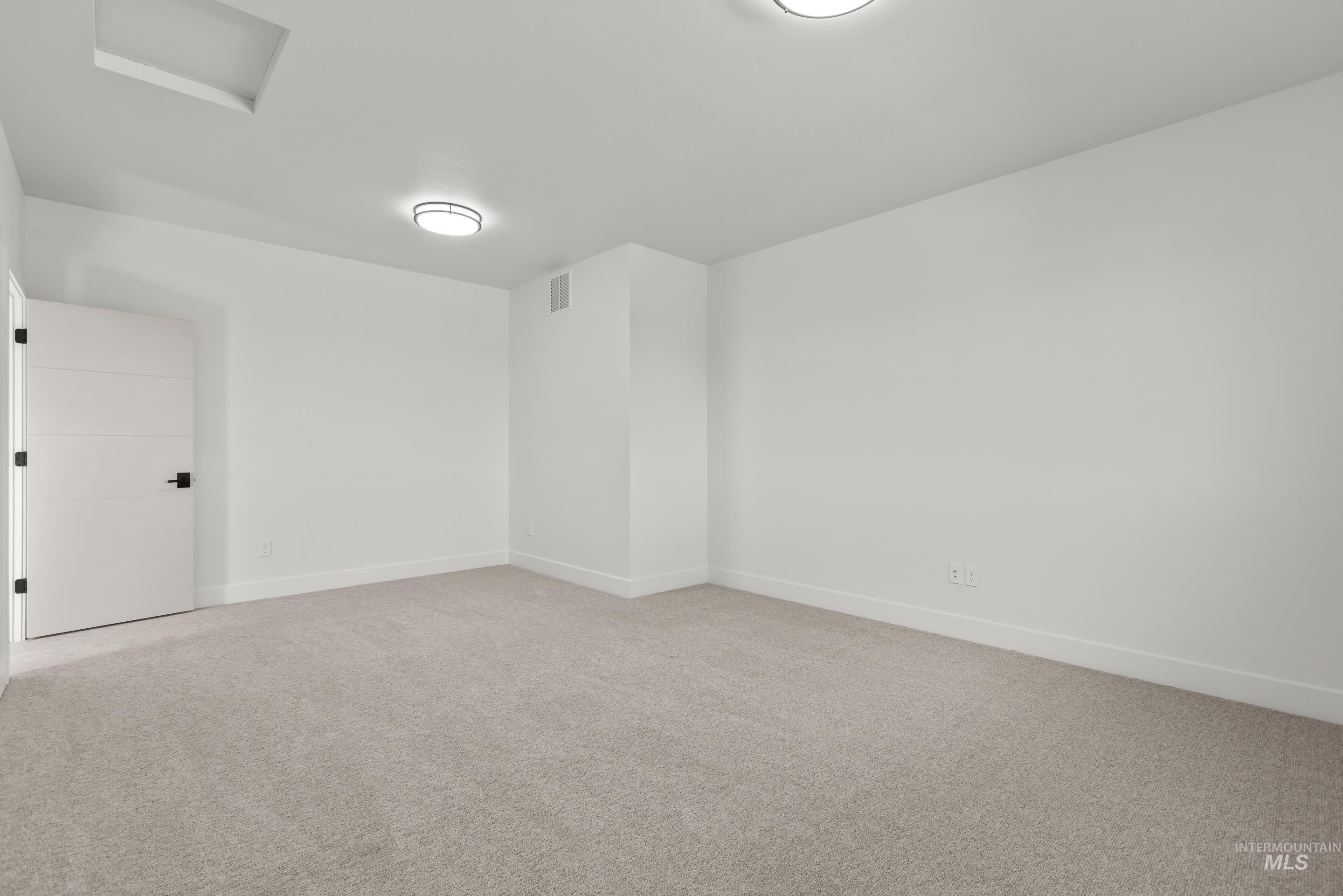 13 Blk 7 E Strut Way Boise, ID 83716 - Photo 45 of 50 Unfurnished room with attic access and light carpet