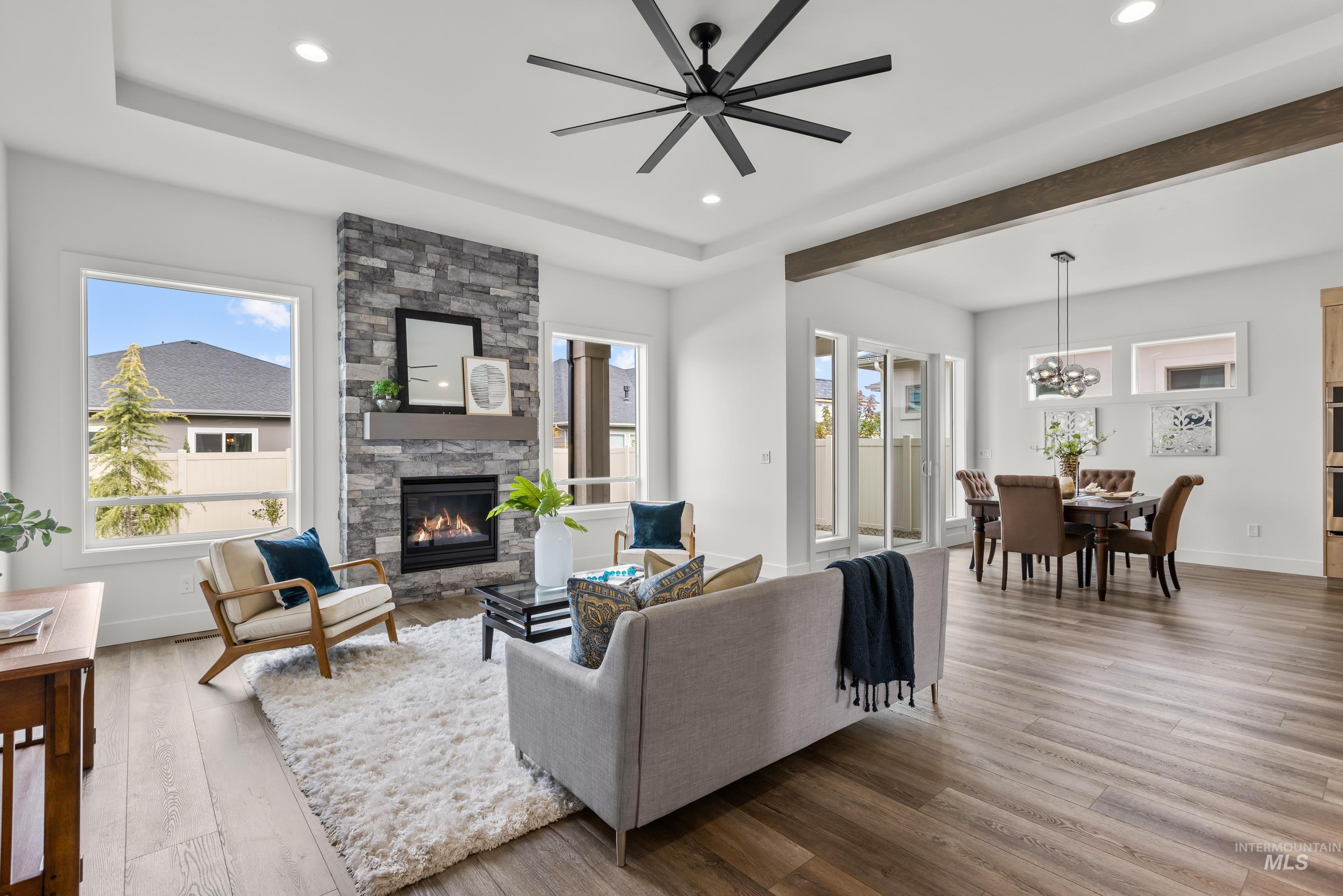 13 Blk 7 E Strut Way Boise, ID 83716 - Photo 7 of 50 Living room with recessed lighting, wood finished floors, a fireplace, and ceiling fan