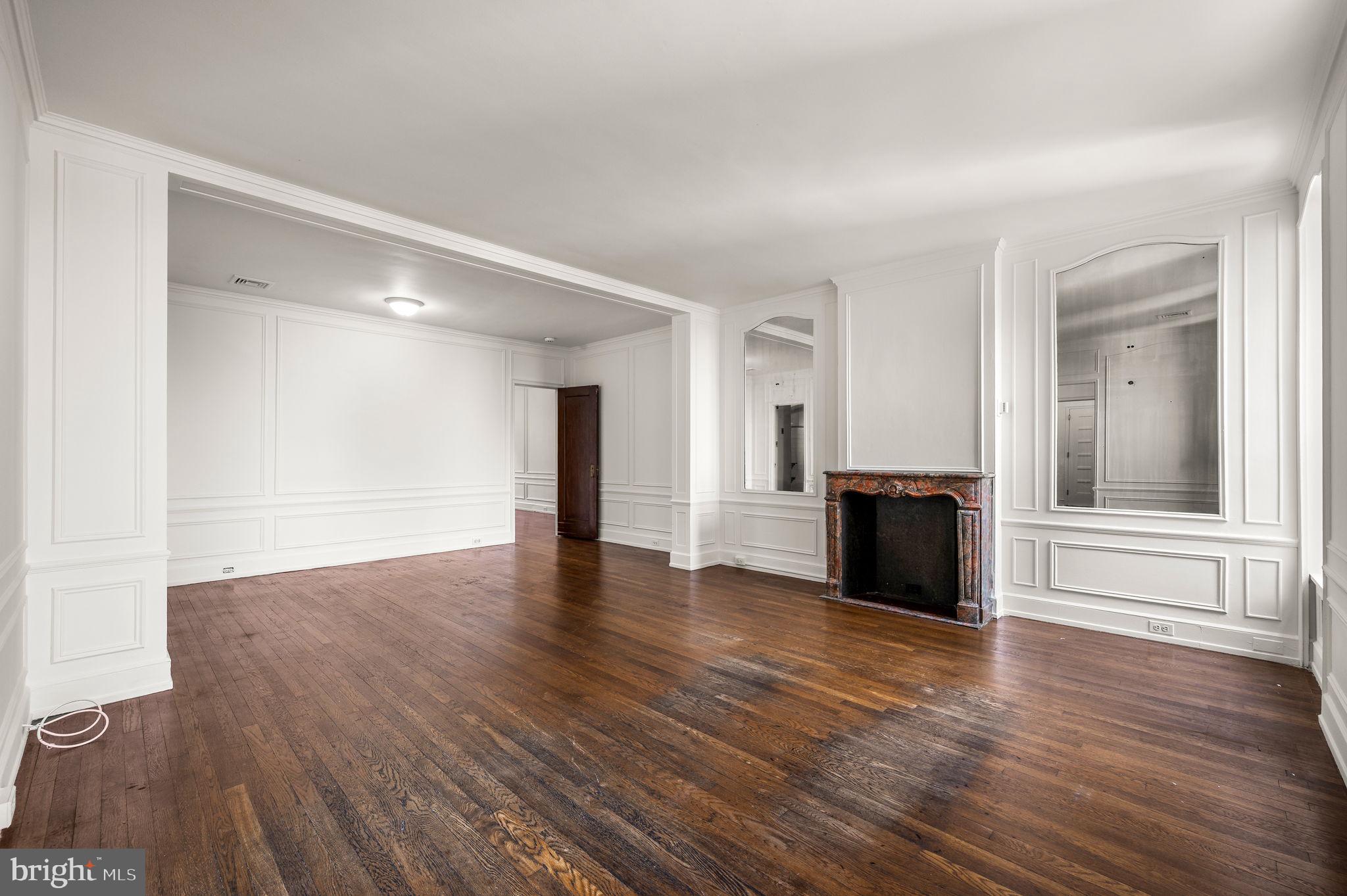 1901 Walnut Street, Unit 20B Philadelphia, PA 19103 - Photo 7 of 24 a view of an empty room and wooden floor