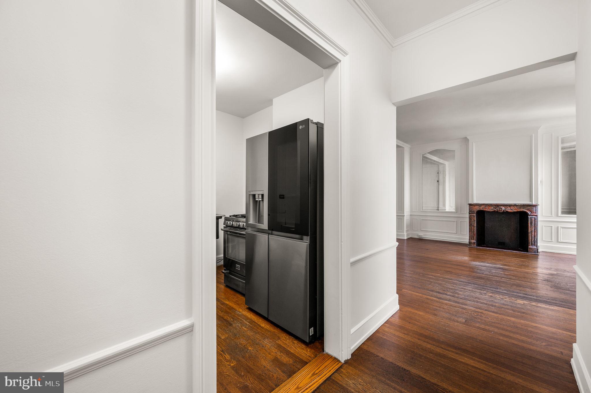 1901 Walnut Street, Unit 20B Philadelphia, PA 19103 - Photo 9 of 24 a view of a kitchen from the hallway