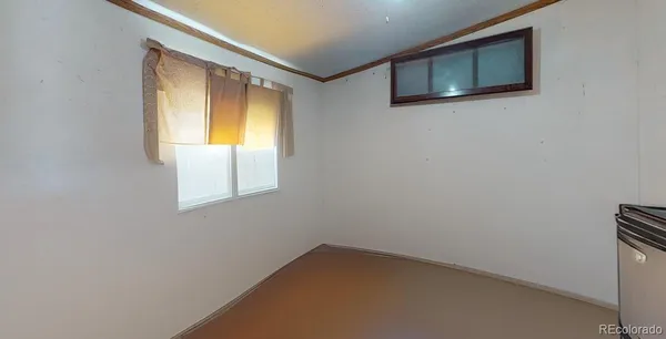 a bathroom with a toilet and a shower curtain