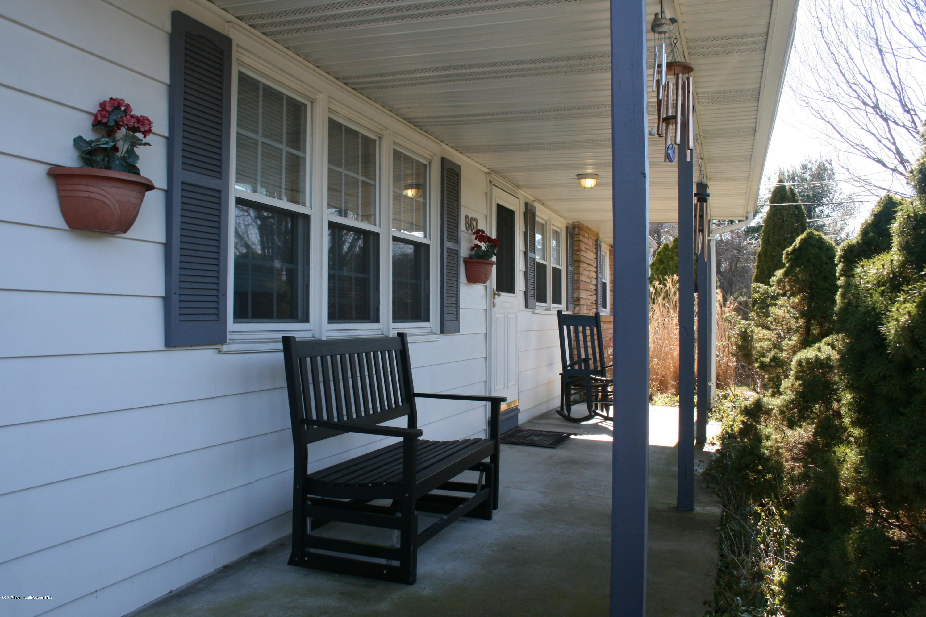 867 Monmouth Road Cream Ridge, NJ 08514 - Photo 1 of 19 a view of porch with a bench