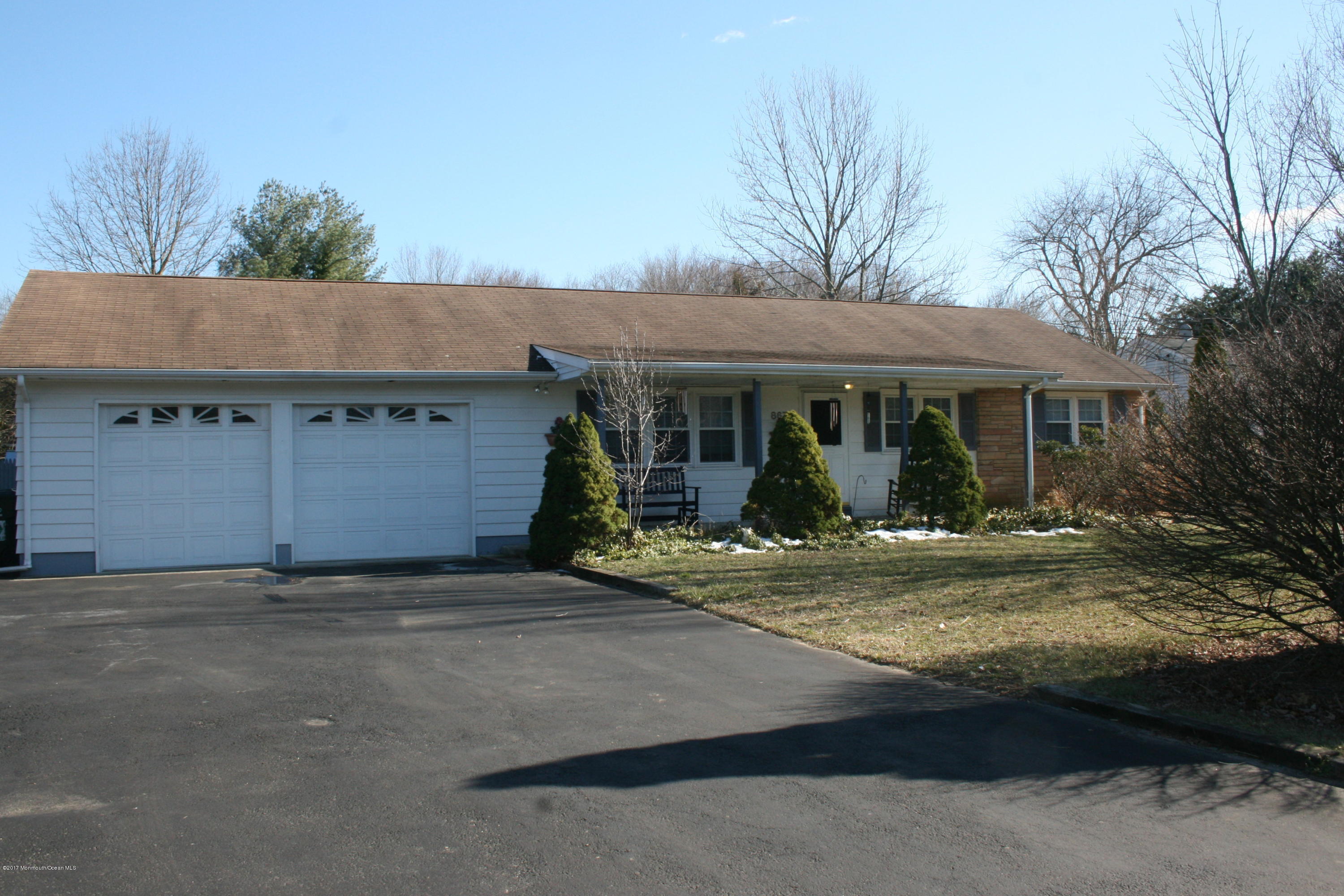 867 Monmouth Road Cream Ridge, NJ 08514 - Photo 2 of 19 a front view of a house with garden
