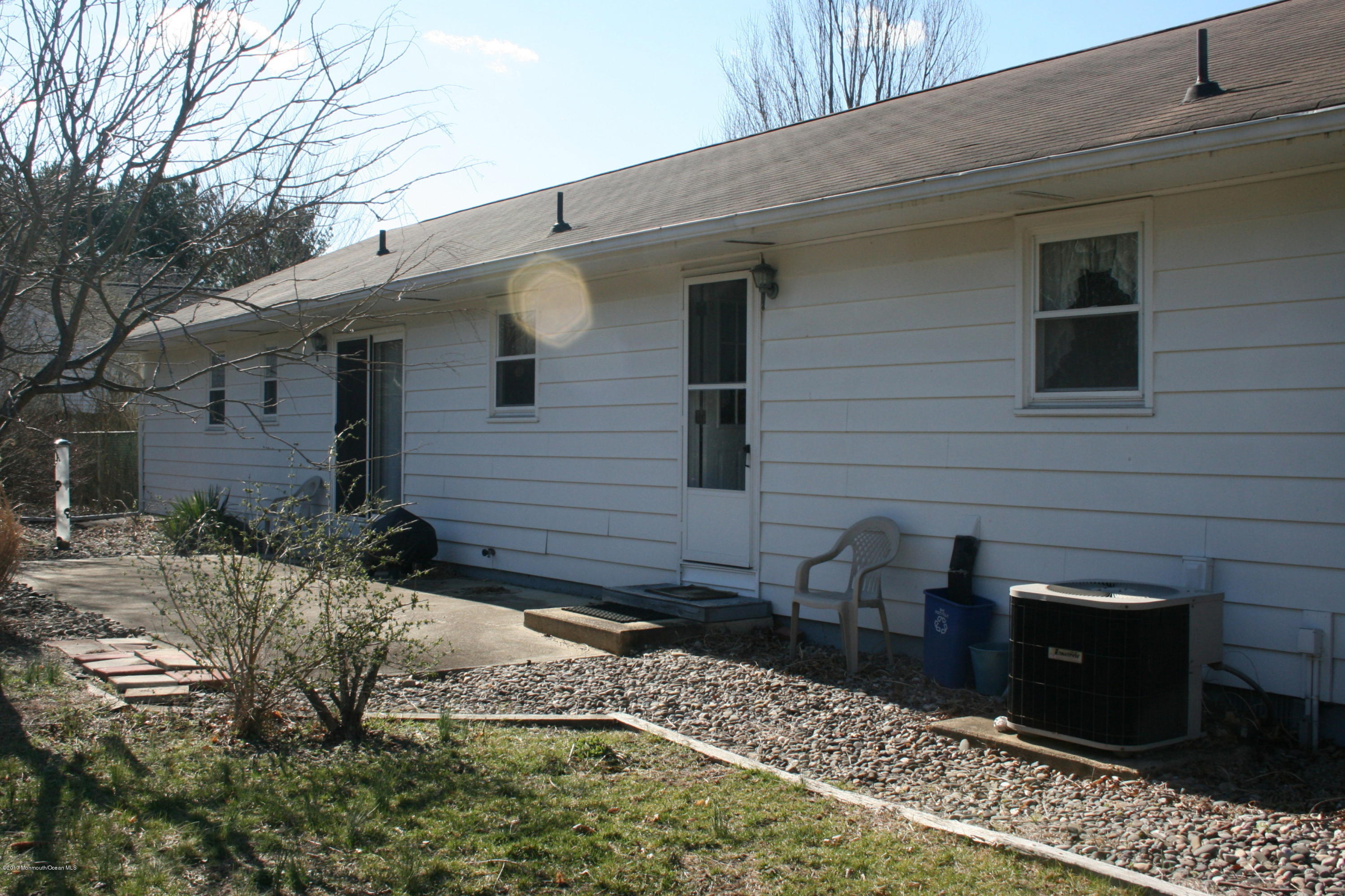 867 Monmouth Road Cream Ridge, NJ 08514 - Photo 17 of 19 a view of a backyard with sitting area