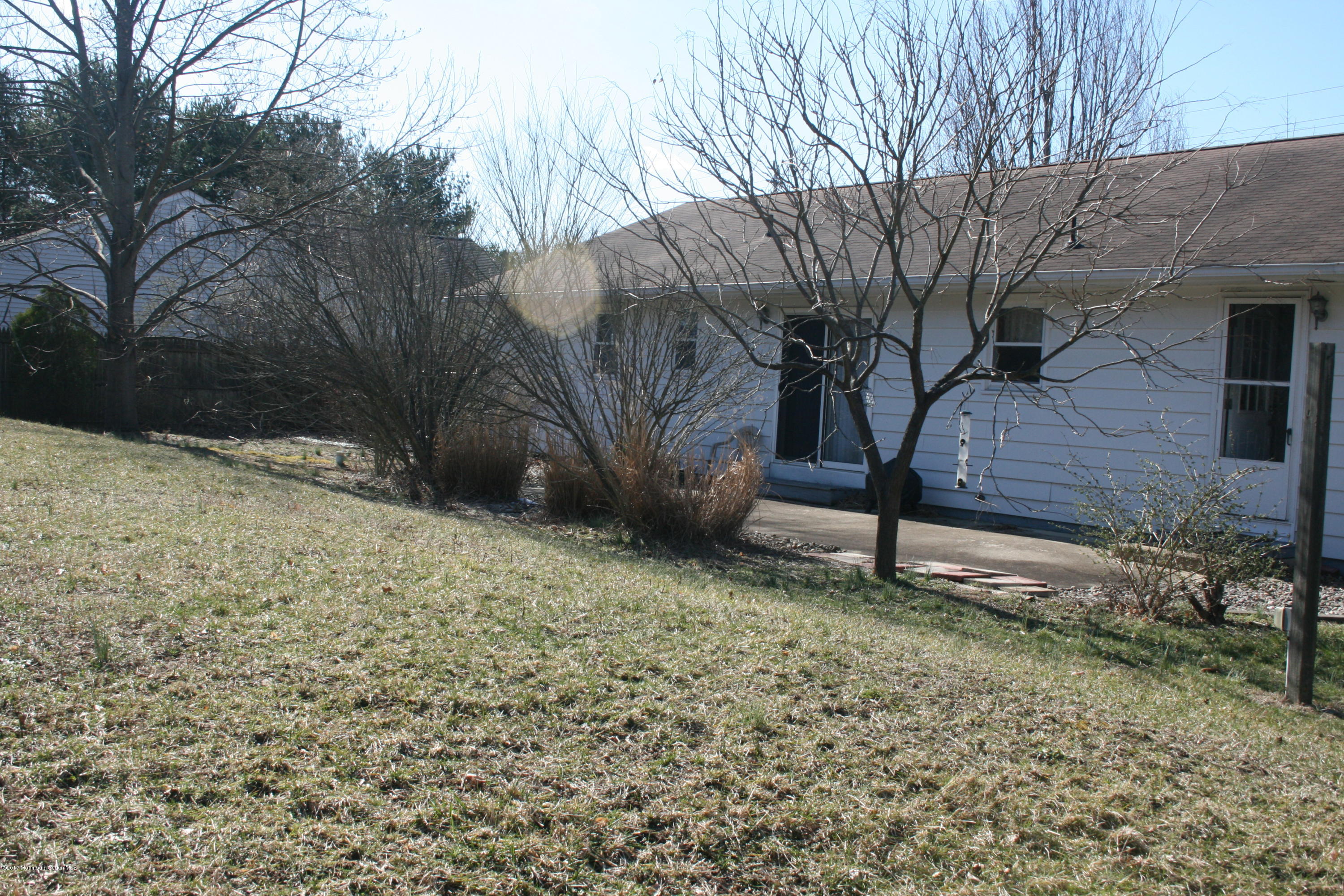 867 Monmouth Road Cream Ridge, NJ 08514 - Photo 19 of 19 a backyard of a house with lots of green space