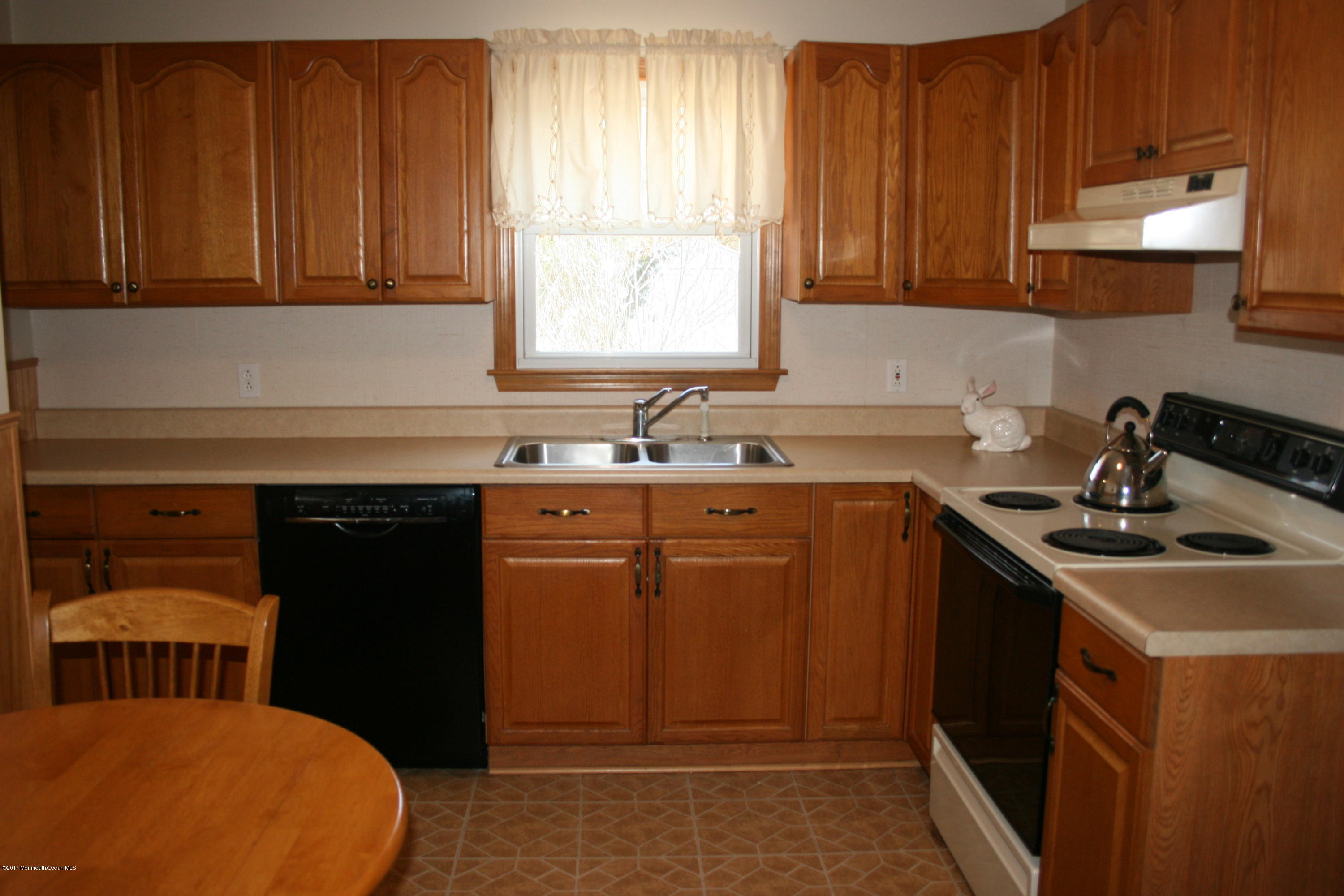 867 Monmouth Road Cream Ridge, NJ 08514 - Photo 7 of 19 a kitchen with a sink cabinets and window