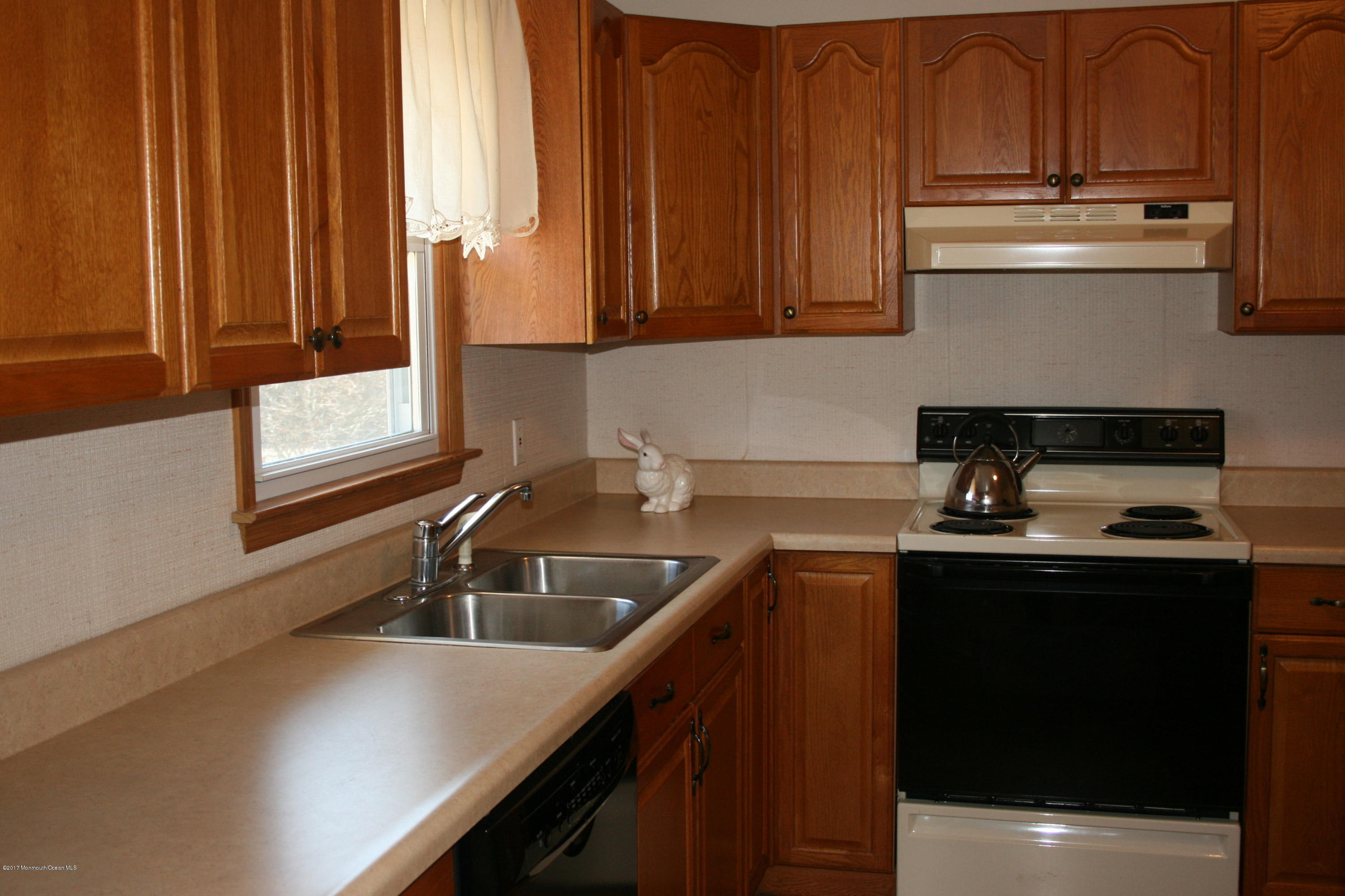 867 Monmouth Road Cream Ridge, NJ 08514 - Photo 8 of 19 a kitchen with stainless steel appliances a sink stove and cabinets