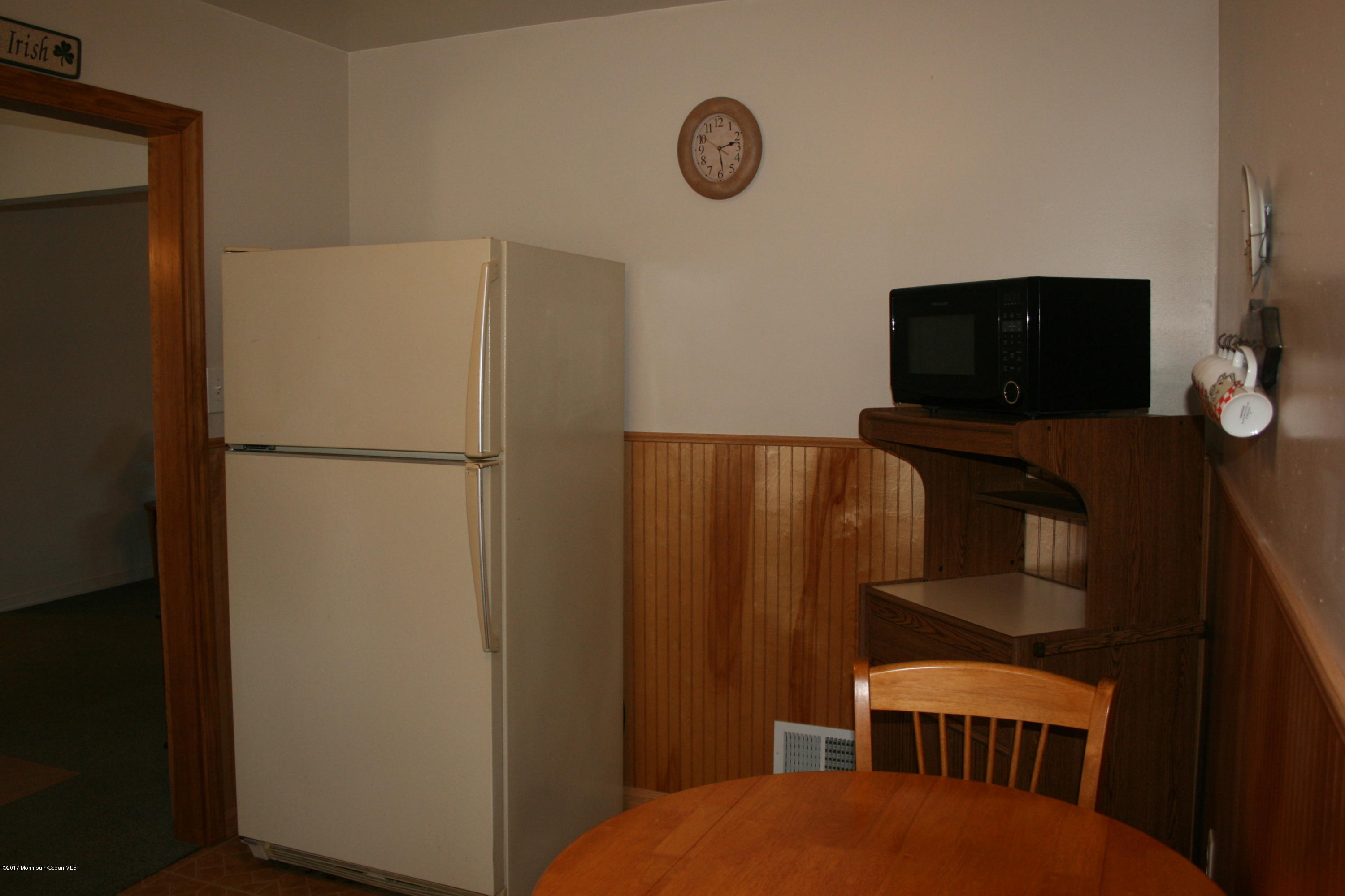 867 Monmouth Road Cream Ridge, NJ 08514 - Photo 9 of 19 a bedroom with a bed and a flat screen tv