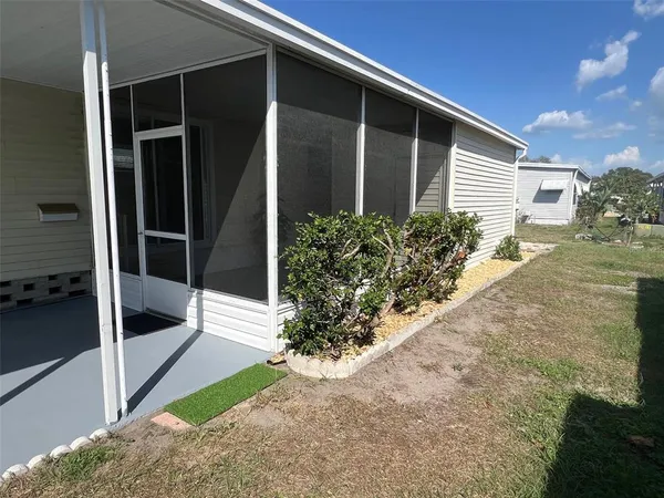 a view of a backyard of the house