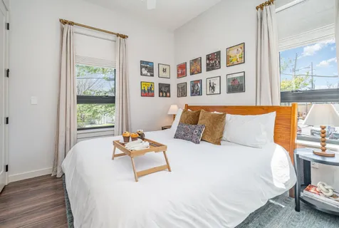 a bedroom with a bed furniture and a window