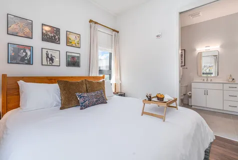 a bedroom with a bed and walk in closet