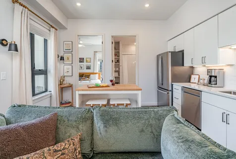 a living room with furniture and a table