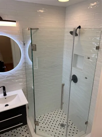 a bathroom with a sink and mirror