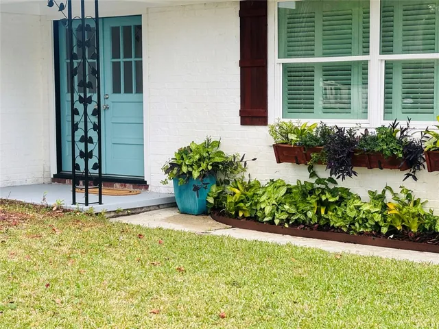 a room with potted plants and a shower