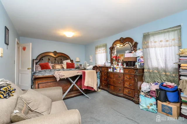a bed room with furniture and a window