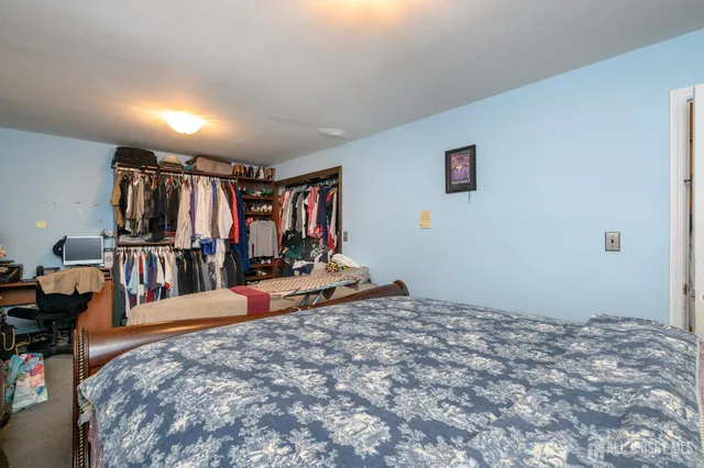 a bed room with a bed and a gym equipment