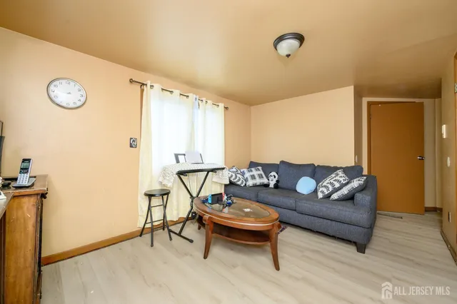 a living room with furniture and a table