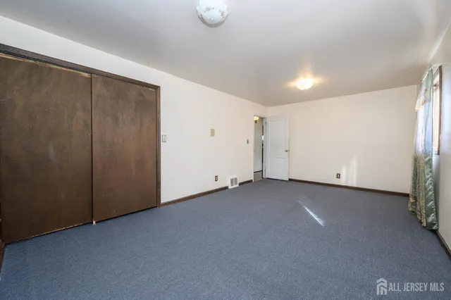 a bathroom with a sink mirror vanity and toilet