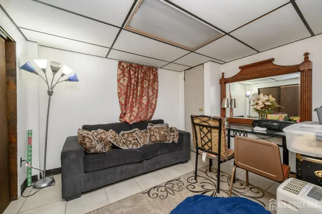 a bed room with furniture and a window