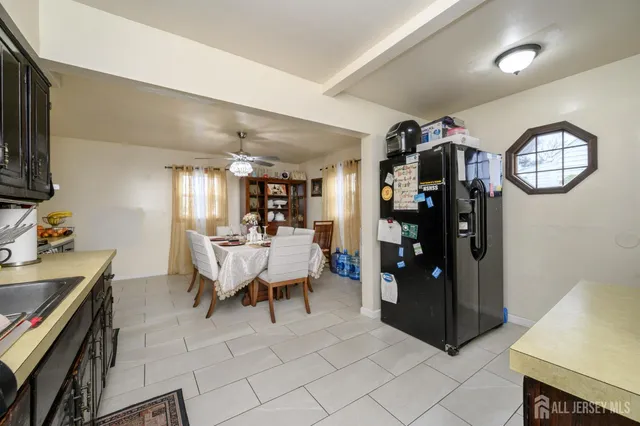 a dining room with furniture and a window