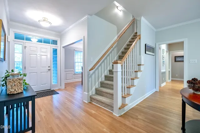 a living room with a fireplace and a flat screen tv
