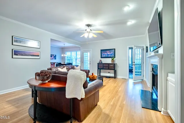 a kitchen with stainless steel appliances granite countertop wooden floors and wooden cabinets