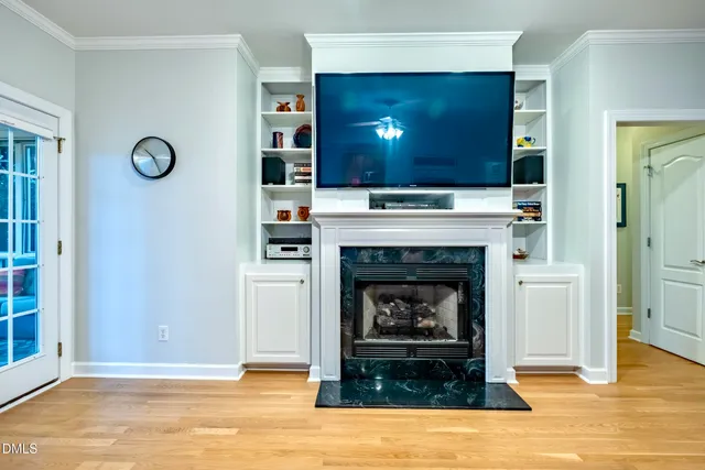a view of walk in closet with clothes