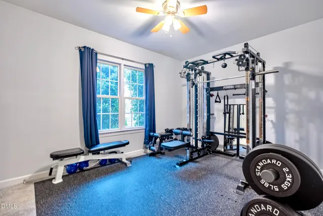 an aerial view of a house with garden space and street view