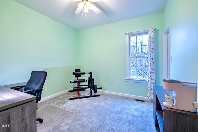 an aerial view of a house with outdoor space