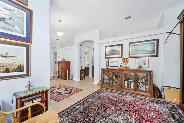 a living room with furniture and a rug
