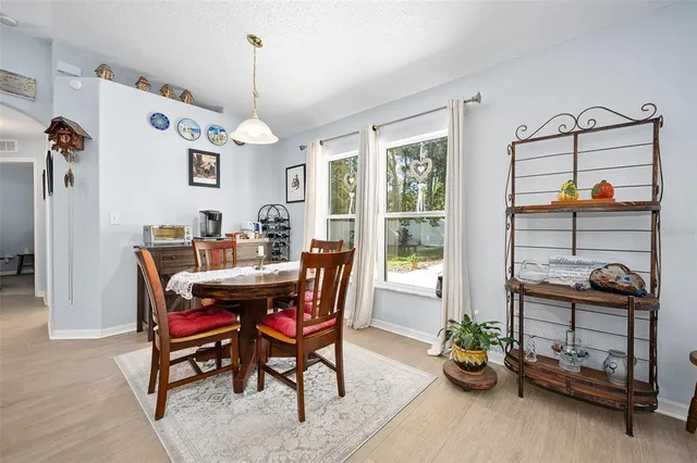 a kitchen with stainless steel appliances granite countertop a stove and a microwave