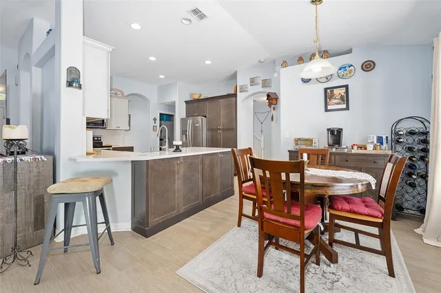 a kitchen with stainless steel appliances granite countertop a stove microwave and cabinets